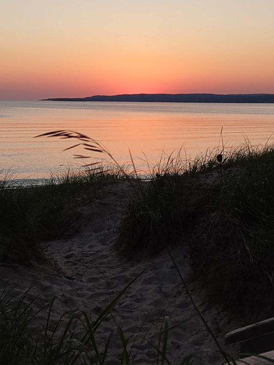 The last rays of sunset at Petrosky beach. You can see the path from our campsite in the foreground.